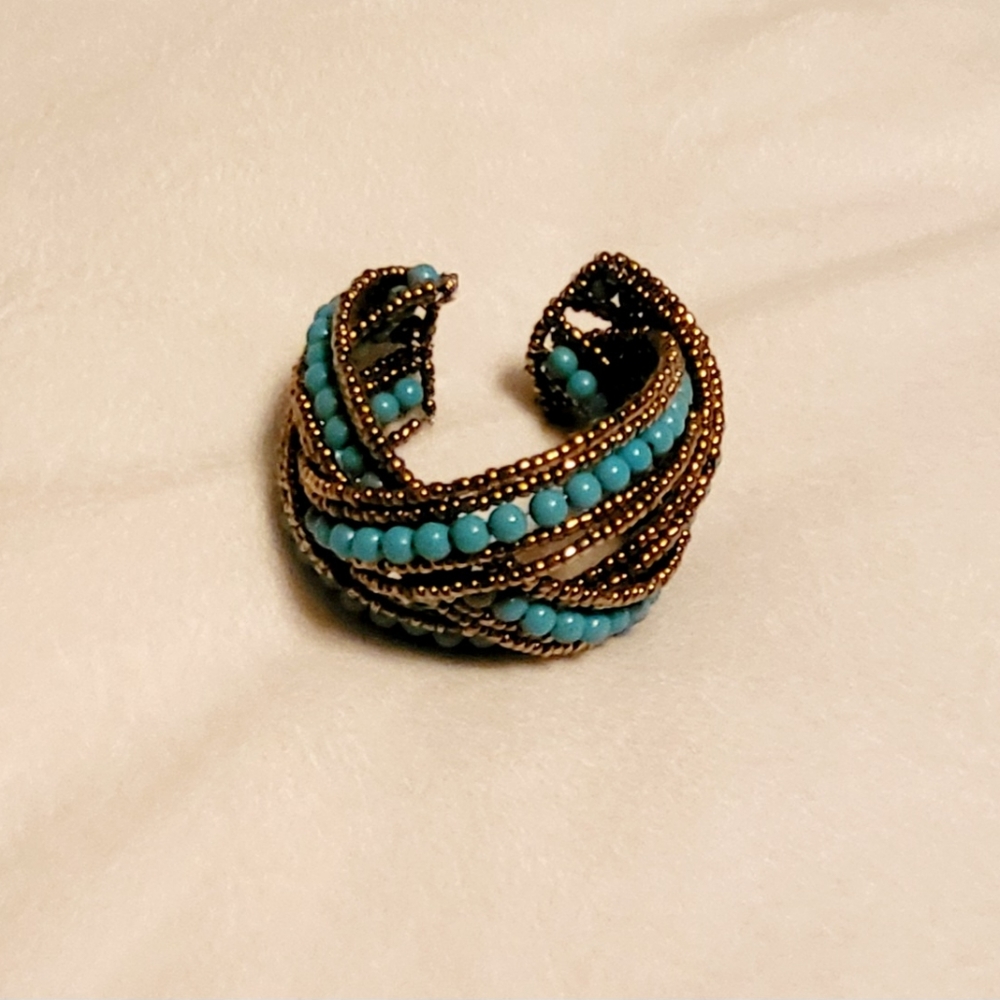 Gold and turquoise beads weave adjustable elegance.